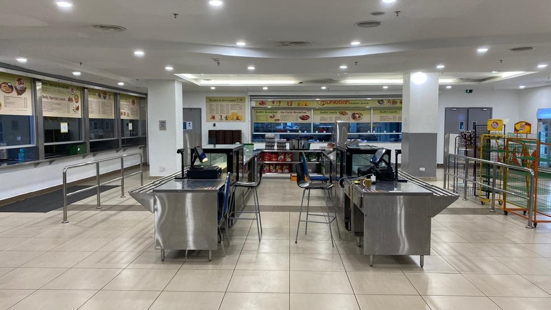 Industrial canteen serving line during shift change